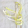 white-and-yellow-handmade-wedding-wands-with-bells-for-wedding-send-offs